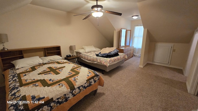 bedroom featuring carpet flooring, baseboards, lofted ceiling, and a ceiling fan