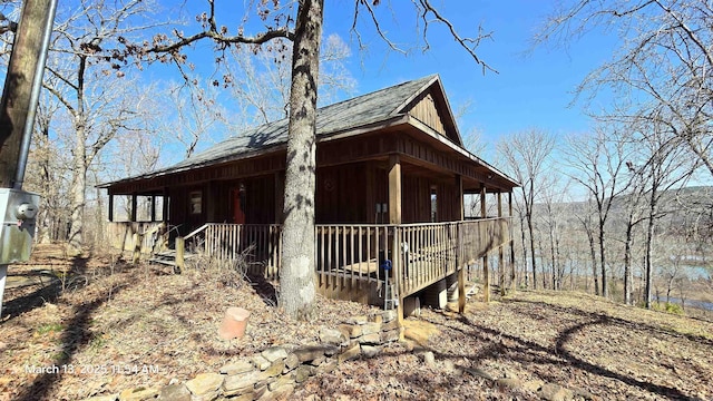 view of property exterior with covered porch