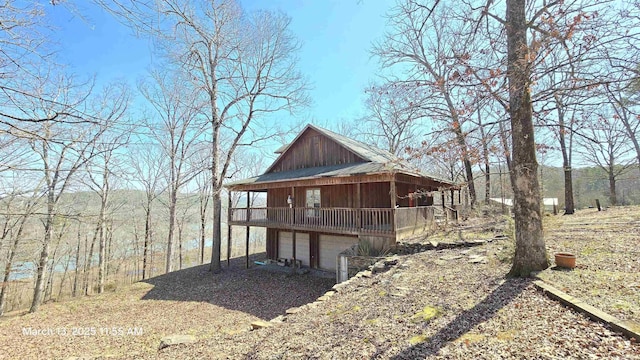 view of outdoor structure featuring an attached garage and driveway