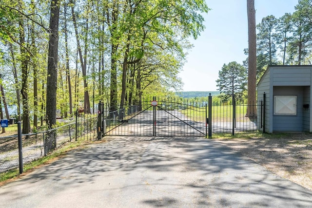 view of gate with fence