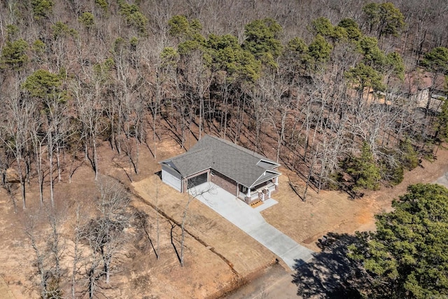 drone / aerial view with a view of trees