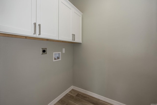 clothes washing area featuring baseboards, washer hookup, wood finished floors, cabinet space, and electric dryer hookup