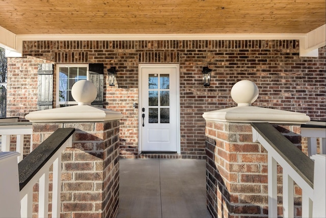 entrance to property with brick siding