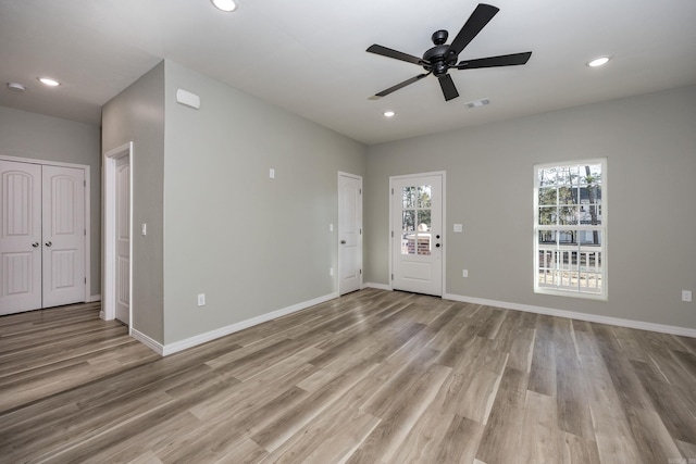 interior space featuring recessed lighting, a healthy amount of sunlight, and visible vents