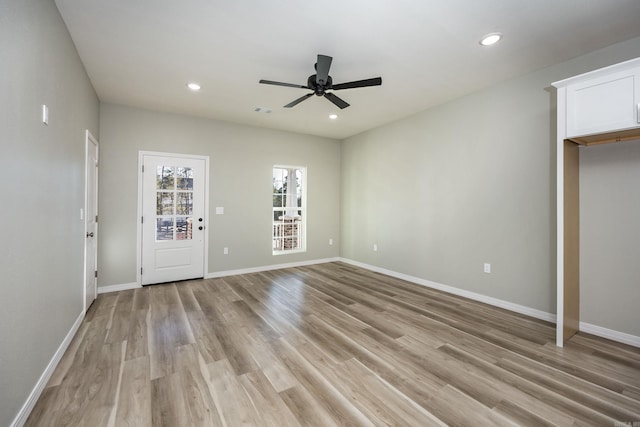 interior space featuring light wood finished floors, recessed lighting, a ceiling fan, and baseboards