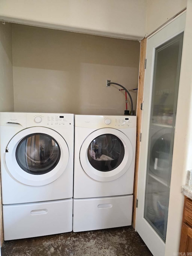 laundry room featuring laundry area and washer and clothes dryer