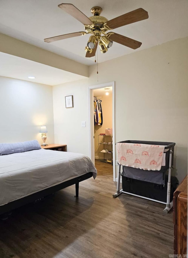 bedroom with wood finished floors and a ceiling fan