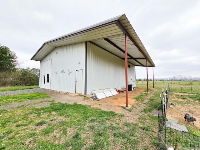 view of pole building with driveway