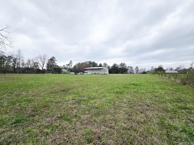 view of yard with a rural view