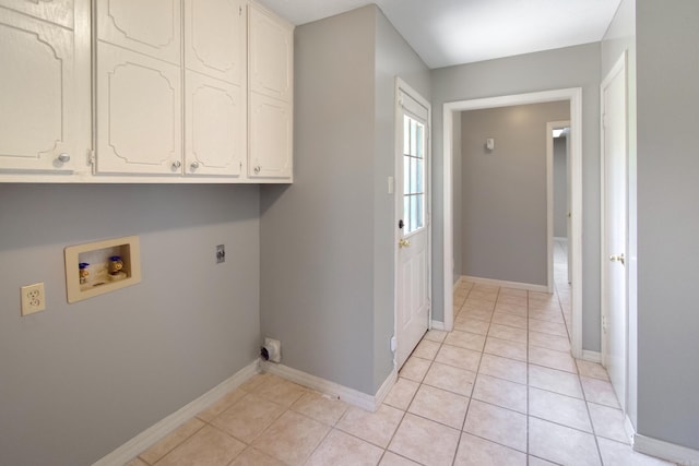 washroom featuring hookup for a washing machine, light tile patterned floors, cabinet space, and hookup for an electric dryer