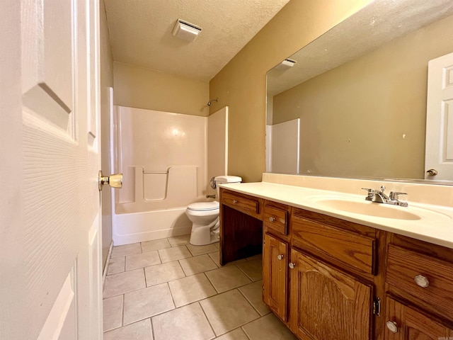 full bathroom with vanity, bathtub / shower combination, a textured ceiling, tile patterned floors, and toilet