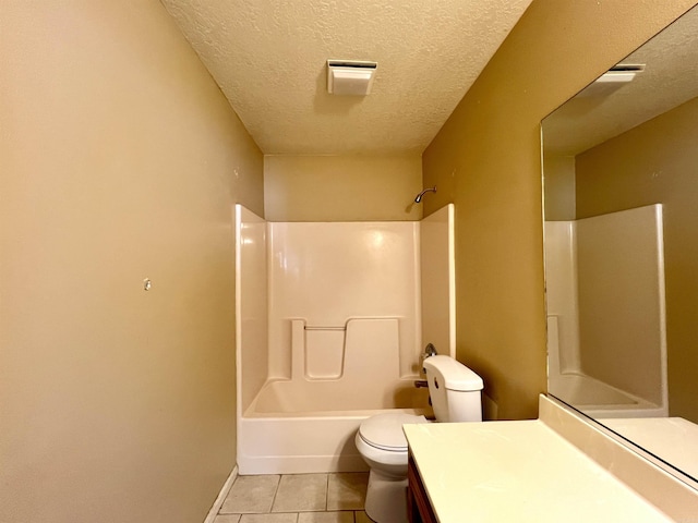 bathroom featuring vanity, tile patterned floors, toilet, and a textured ceiling