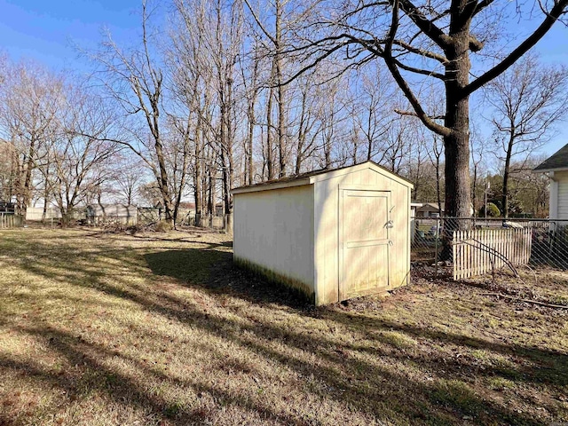 view of shed with fence