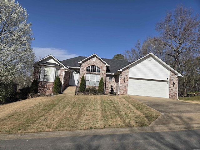 single story home featuring a garage, brick siding, concrete driveway, and a front yard