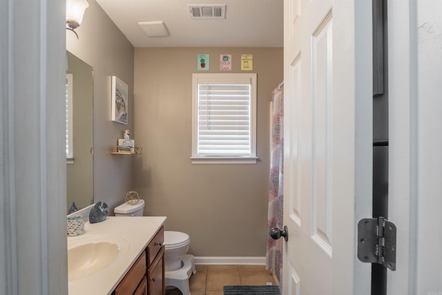 full bath featuring vanity, visible vents, baseboards, tile patterned flooring, and toilet