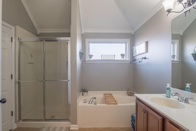 bathroom featuring a garden tub, vanity, a stall shower, and crown molding