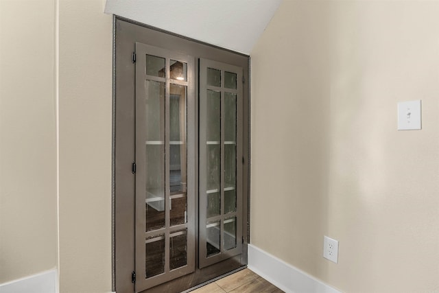 room details featuring baseboards and wood finished floors