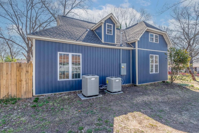 exterior space featuring cooling unit and fence