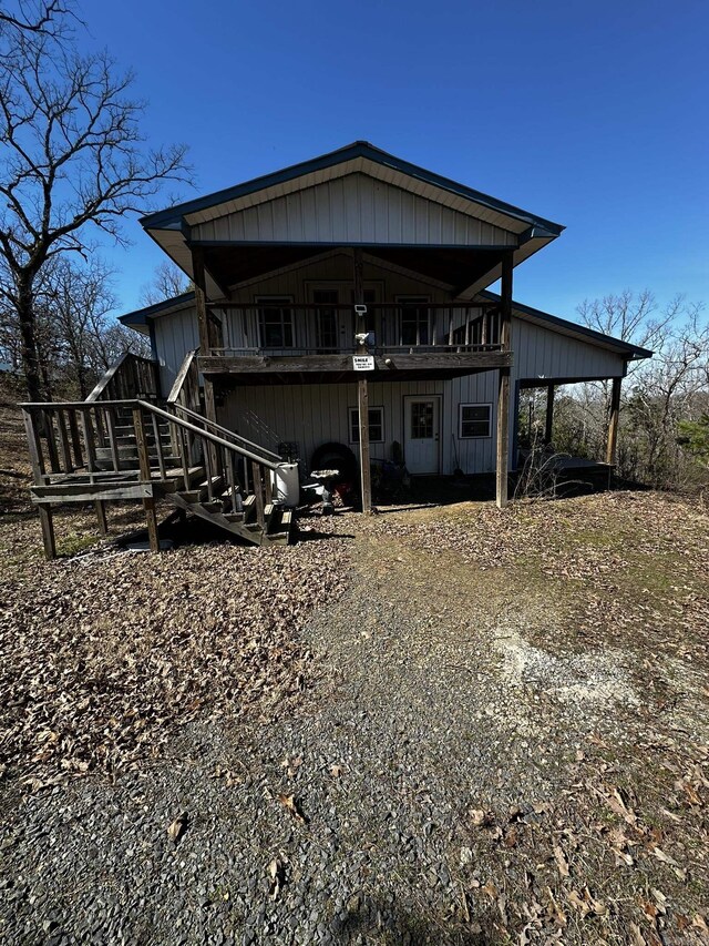 view of front of house with stairs