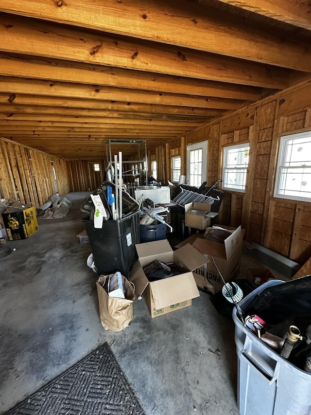 misc room with unfinished concrete floors