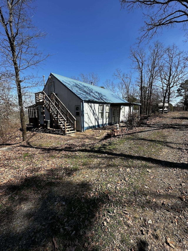 view of side of property with metal roof