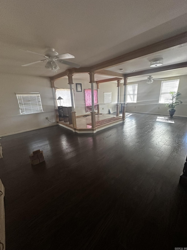 garage with baseboards and ceiling fan