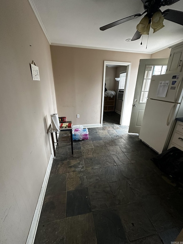 corridor with stone tile flooring, baseboards, and ornamental molding