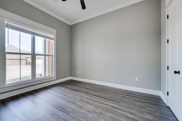 spare room with ornamental molding, baseboards, a ceiling fan, and dark wood-style flooring