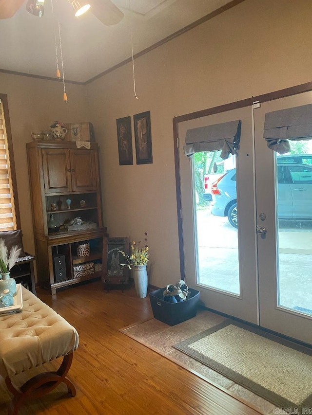 foyer with dark wood finished floors and a ceiling fan