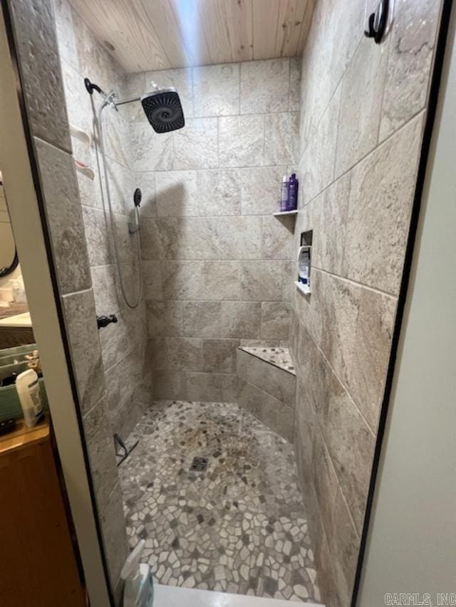 full bath with a tile shower