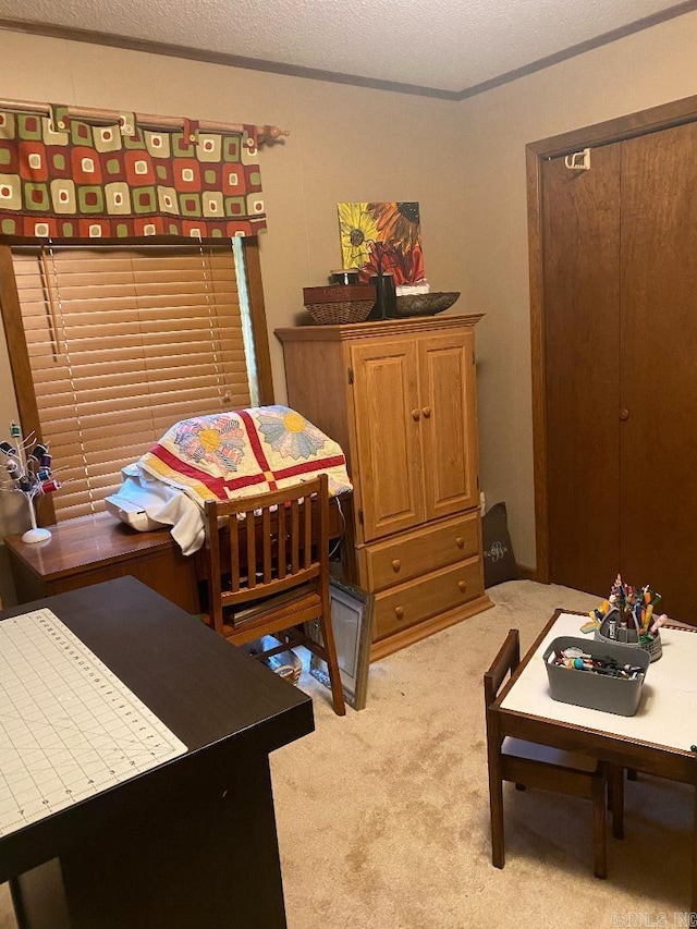 carpeted bedroom featuring a textured ceiling and ornamental molding