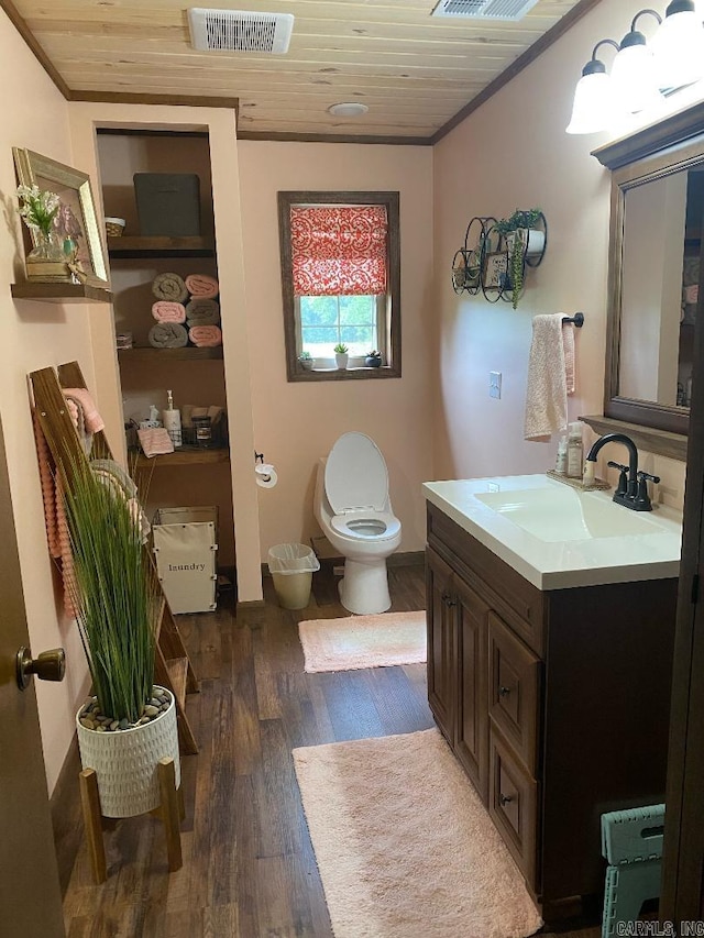 bathroom featuring wood finished floors, toilet, wood ceiling, and visible vents