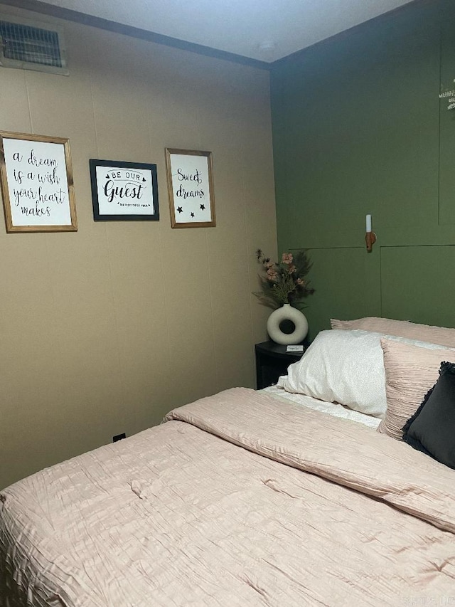 bedroom featuring visible vents