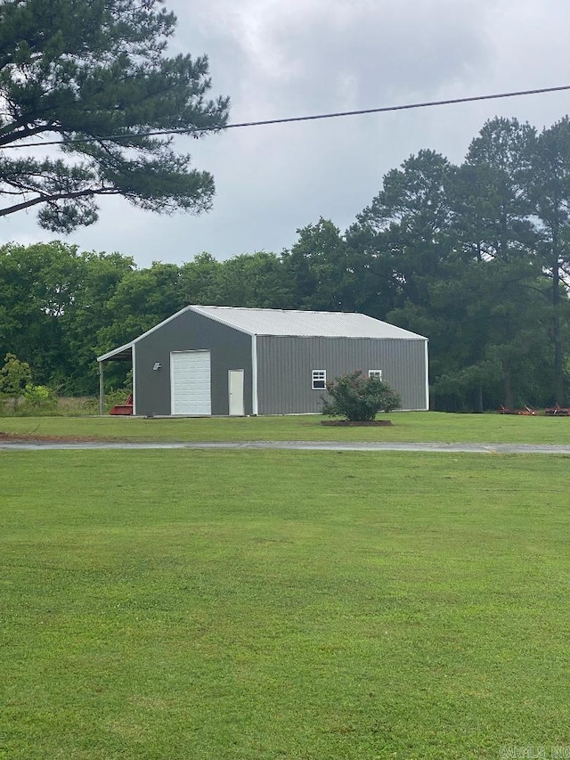 view of pole building with a lawn