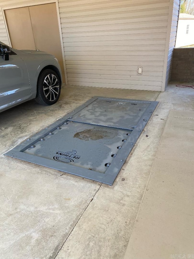 view of storm shelter featuring a garage