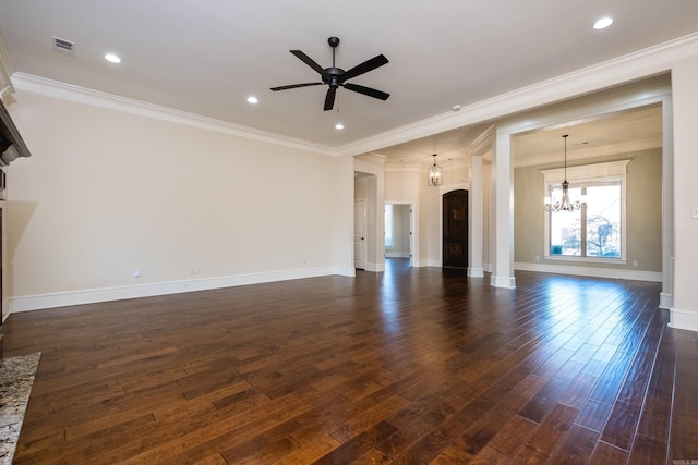 unfurnished living room with visible vents, arched walkways, dark wood-style floors, and ceiling fan with notable chandelier