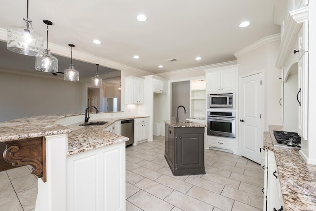 kitchen with recessed lighting, a sink, hanging light fixtures, ornamental molding, and stainless steel appliances