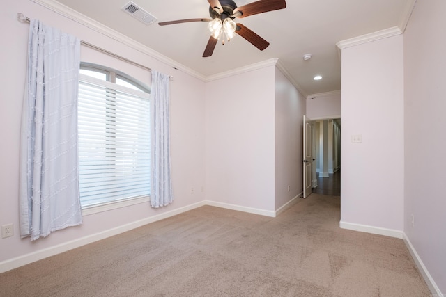 carpeted spare room with visible vents, a ceiling fan, recessed lighting, crown molding, and baseboards