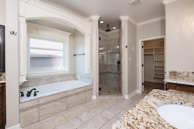 full bath with visible vents, a shower stall, crown molding, a garden tub, and vanity