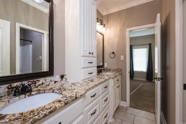 full bathroom with tile patterned flooring, ornamental molding, double vanity, and a sink