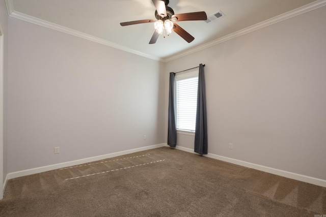 carpeted empty room with visible vents, a ceiling fan, baseboards, and ornamental molding