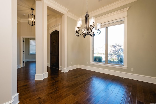 unfurnished dining area with a notable chandelier, dark wood-style floors, baseboards, and ornamental molding