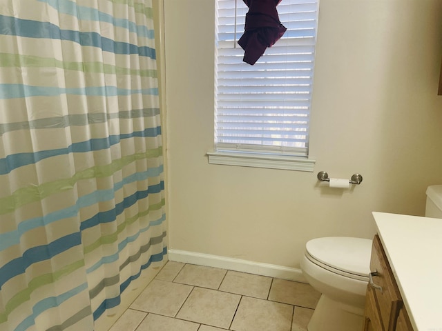 full bath featuring vanity, tile patterned floors, toilet, and baseboards