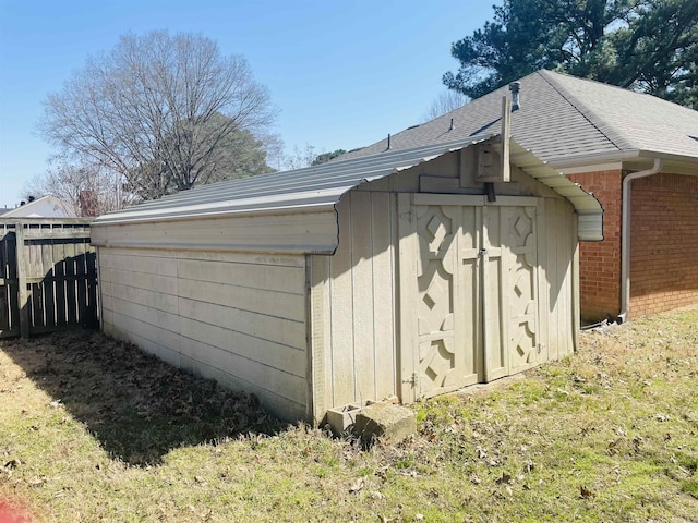 view of shed with fence