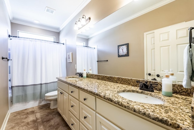 bathroom with a sink, toilet, and ornamental molding