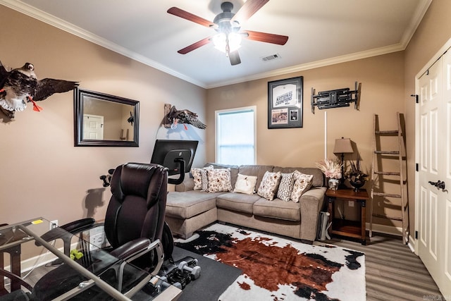 office area featuring ornamental molding, wood finished floors, visible vents, and ceiling fan