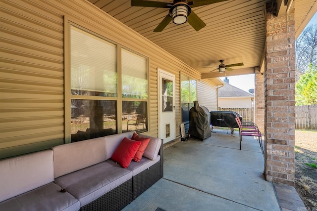 view of patio featuring an outdoor hangout area, a ceiling fan, and fence