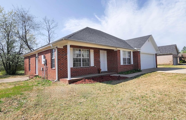 single story home with a front lawn, brick siding, concrete driveway, and an attached garage