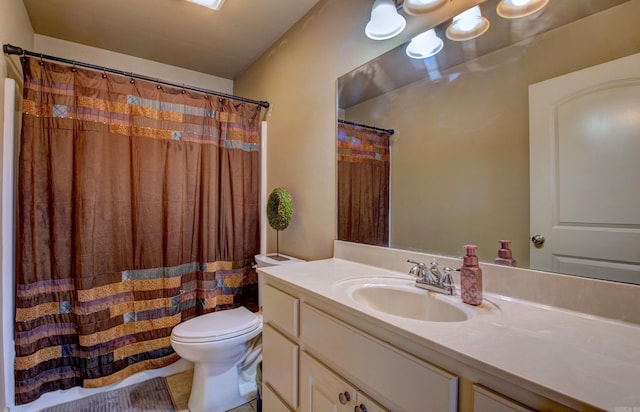 bathroom with toilet and vanity