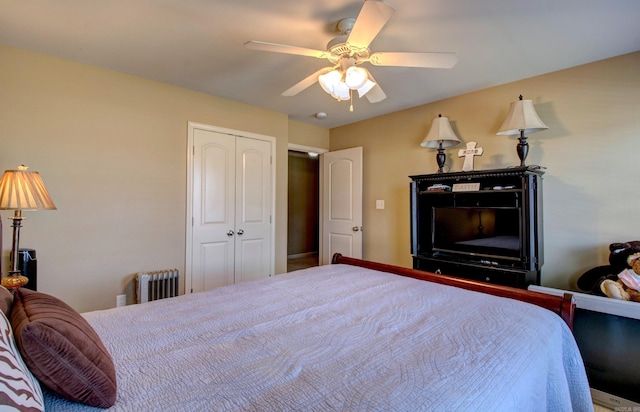 bedroom with radiator, a ceiling fan, and a closet